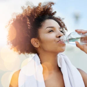 Woman staying hydrated after a workout.