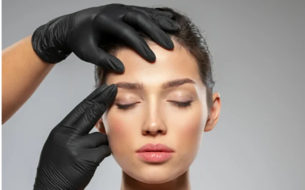 Professional administering Botox treatment at Fleur-De-Lis Aesthetics to reduce facial wrinkles